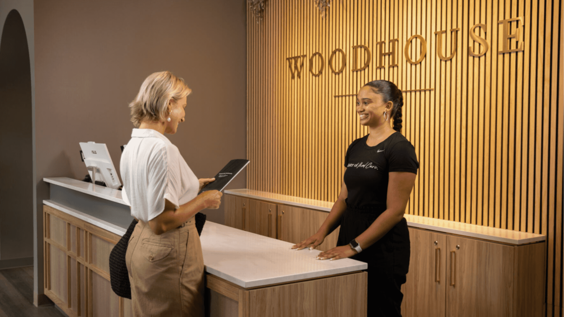Photo of guest checking in at Woodhouse Spas reception desk