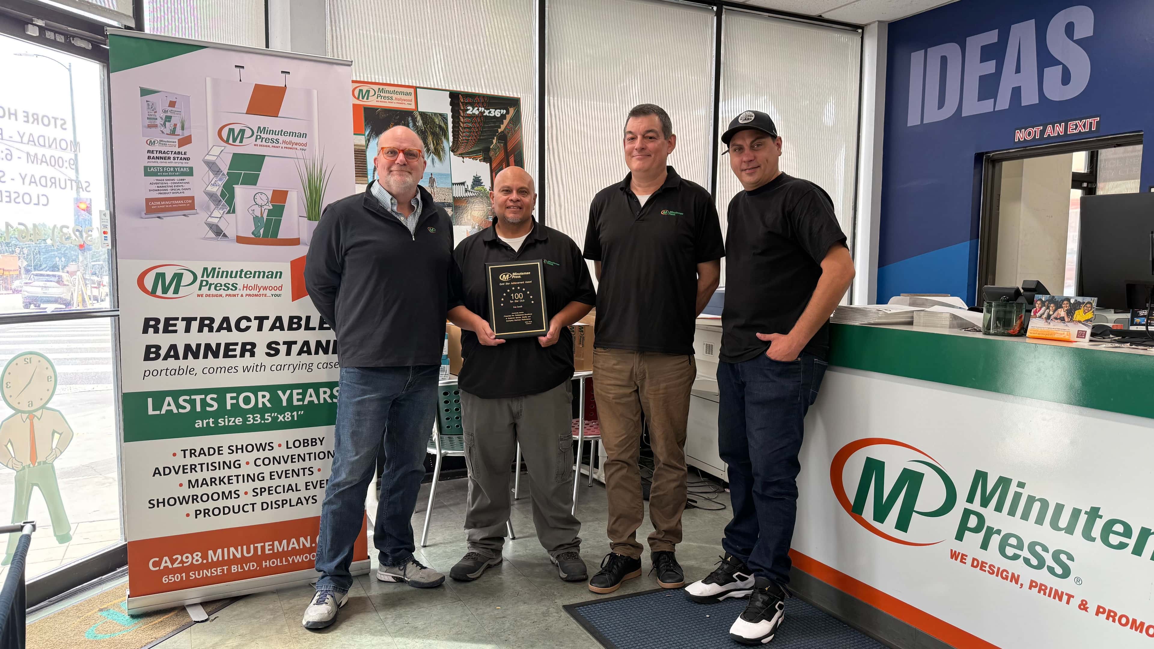 Minuteman Press Franchise Owner Joe Jereb (left) pictured with his dedicated team in Hollywood, CA.