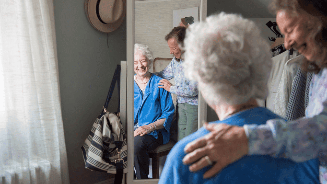 How undefined Evolved and Set New Standards Photo of two seniors looking into full-body mirror, smiling