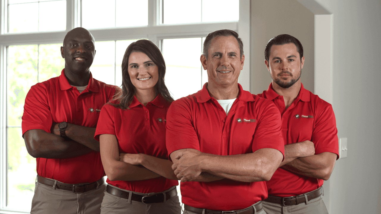 How undefined Evolved and Set New Standards Photo of four HomeTeam Inspection Service inspectors