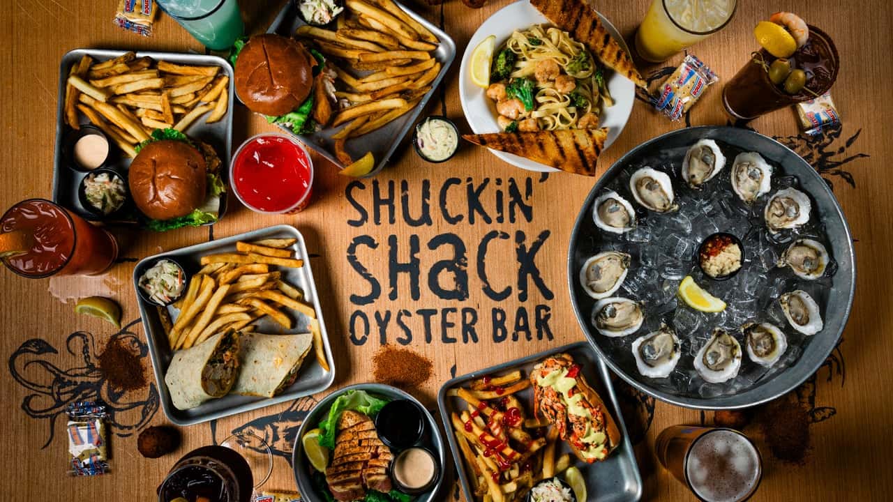 How undefined Evolved and Set New Standards Design with Shuckin' Shack Oyster Bar logo and menu items