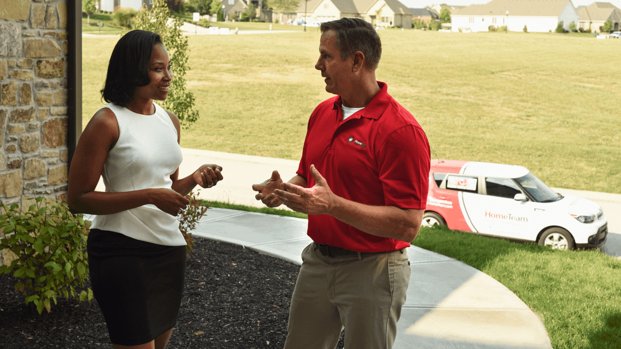 How undefined Evolved and Set New Standards Photo of HomeTeam inspector speaking with another person