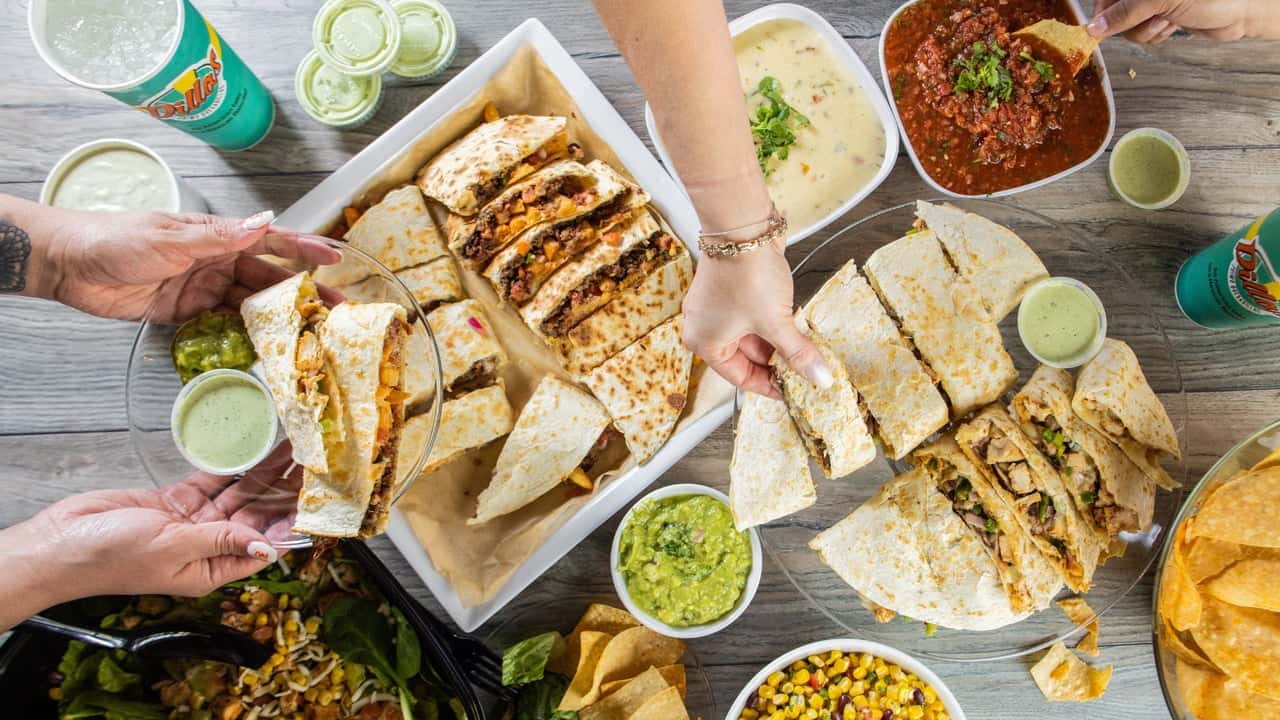 How undefined Evolved and Set New Standards Photo of Dillas Primo Quesadillas, salsa, guacamole and drinks