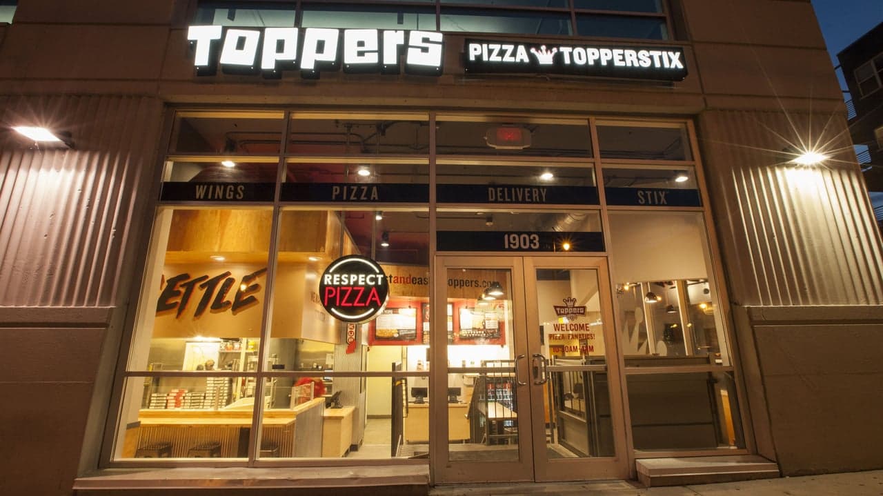 The Janesville Toppers Pizza Is Where Everybody Knows Your Name—And Will Play Your Favorite Song The Janesville Toppers Pizza Is Where Everybody Knows Your Name—And Will Play Your Favorite Song