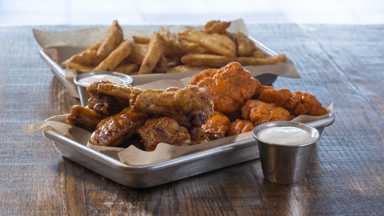 Celebrating 25 Years: How Wing Zone Went From Frat House to Global Franchise Celebrating 25 Years: How Wing Zone Went From Frat House to Global Franchise