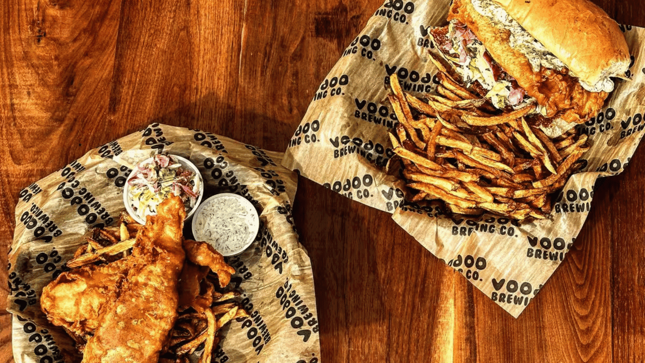 How undefined Evolved and Set New Standards Photo of Voodoo Brewing Co. main dishes on wood table