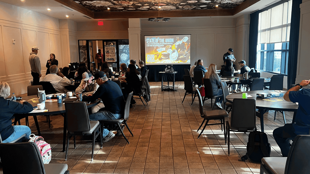 How undefined Evolved and Set New Standards Photo of Shuckin' Shack team gathered in a room for the brand's State of the Union