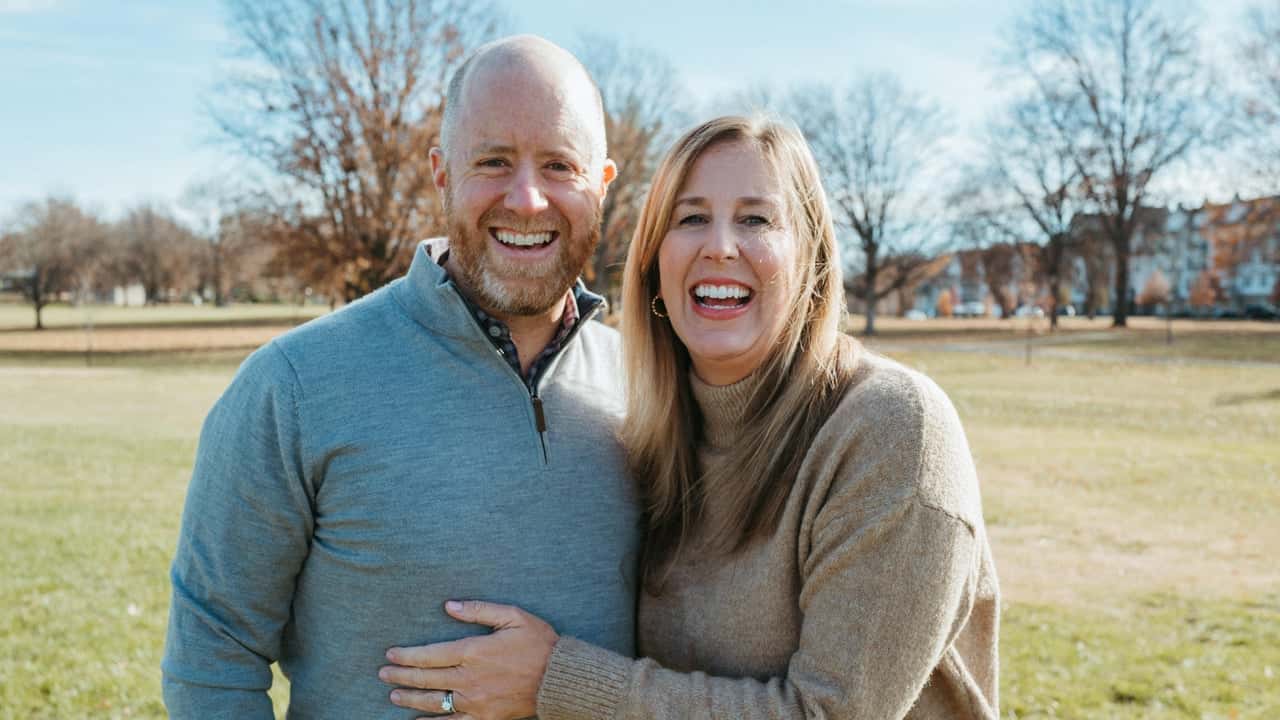 From Spa Day to Franchise Success: How Mark and Julie Rome photo of Mark and Julie Rome, standing outdoors and smiling at the camera