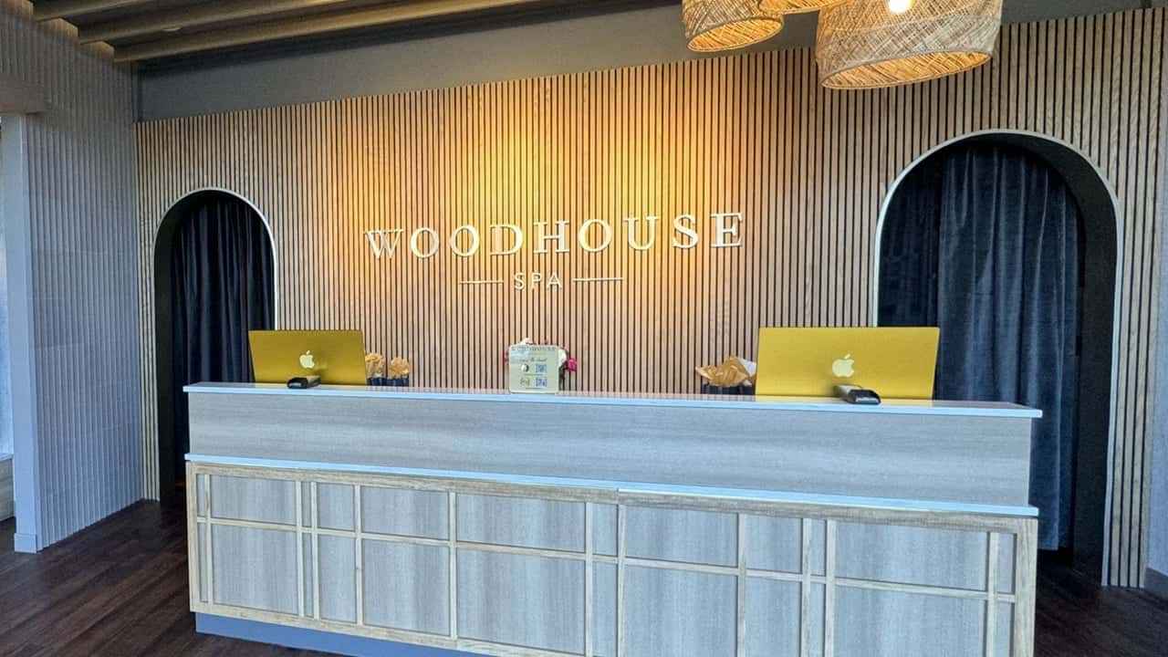 How undefined Evolved and Set New Standards Photo of interior of Woodhouse Spa featuring front desk and wooden paneled wall