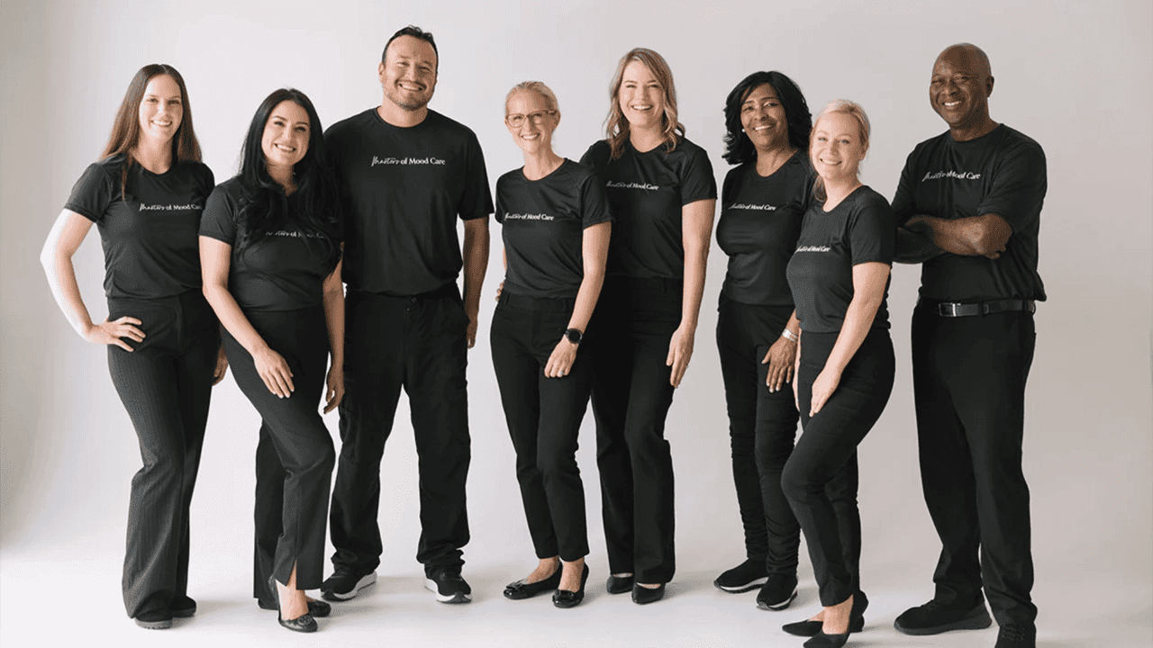 How Woodhouse Spas Solves the Industry’s Labor Challenges Photo of diverse team of Woodhouse Spa team members standing together, smiling