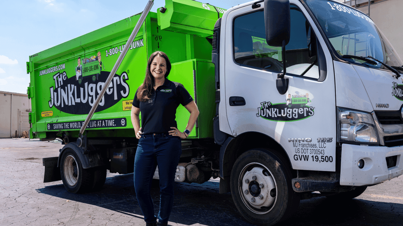 How undefined Evolved and Set New Standards image of a junkluggers franchise owner franchisee standing in front of a company truck succesful
