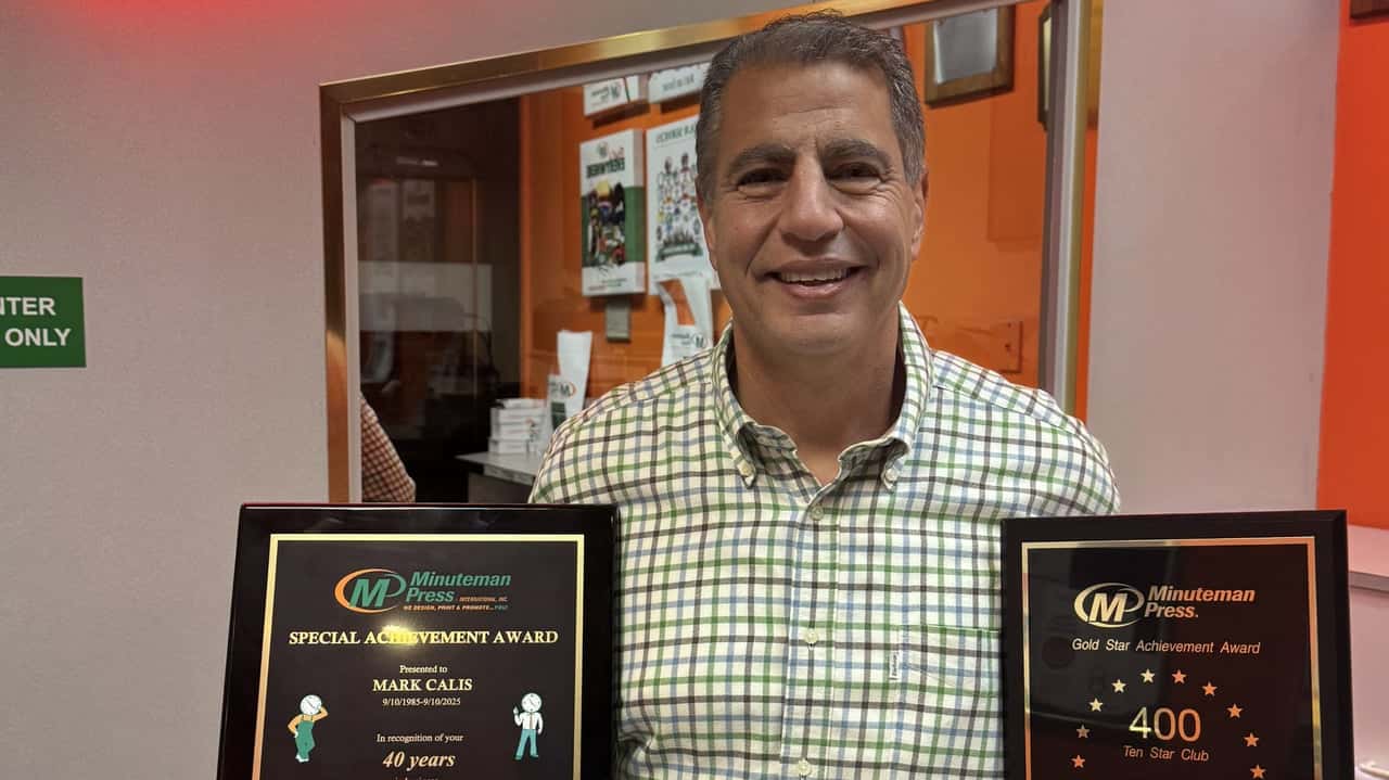Minuteman Press Franchise Owner Mark Calis Celebrates 40 Years in DC Minuteman Press Franchise Owner Mark Calis proudly displays his 40-Year Special Achievement Award.