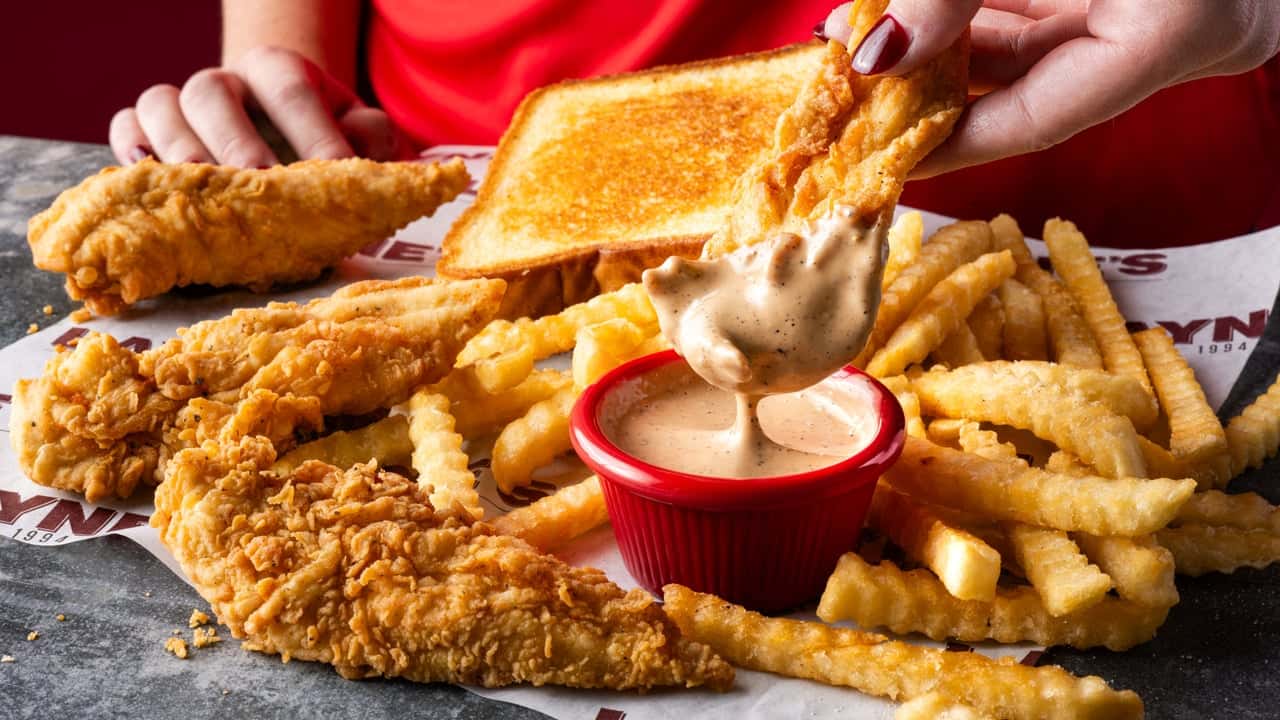Layne’s Chicken Fingers Brings the Crunch to Kingsland Photo of Layne's Chicken Fingers tenders, fries, toast and sauce